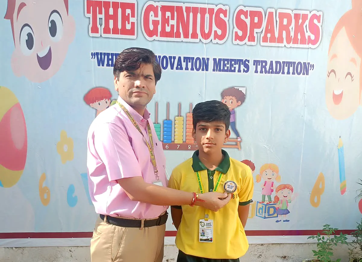 Principal pinning a badge on a student