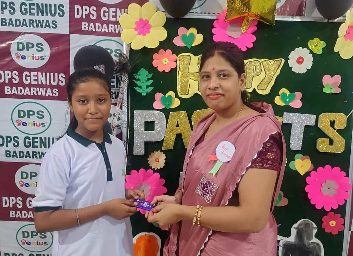 Teacher greeting a student at a school event