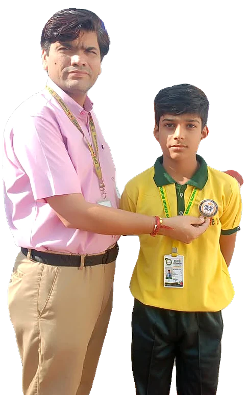 Director Santosh Agarwal pinning a badge on a student